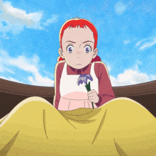 a little girl with red hair is holding a flower in her hand