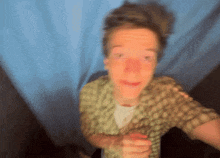 a blurry picture of a man 's face with a blue background