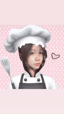 a girl wearing a chef hat and apron holds a spatula