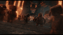 a group of people are standing in front of a fire