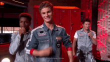 a man in a denim jacket has a patch on his chest that says tommy