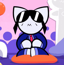 a cartoon cat wearing sunglasses and a tie is sitting on an orange pillow