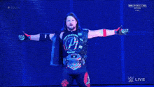 a wrestler is standing in front of a sign that says smack live on it