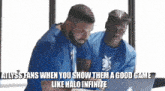 two men are looking at a laptop with a meme that says alyss fans when you show them a good game like halo