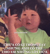 a baby making a funny face with a foreign language caption