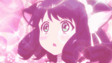 a girl with purple hair and green eyes is wearing a cat ears headband .
