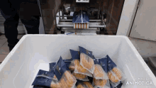 a bunch of bags of food are in a white container with the words made in animotica on the bottom