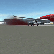 a red and white airplane with the word coca cola on it