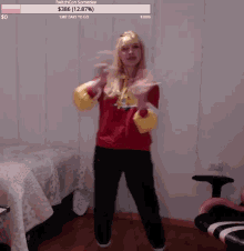 a woman in a red sweater is dancing in a room with a twitch con someday notification