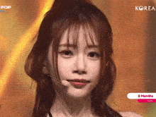 a close up of a woman 's face with the word korea on the bottom
