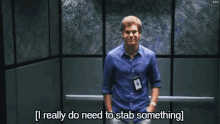a man standing in an elevator with the words i really do need to stab something
