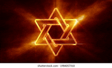 a golden jewish star with rays of light coming out of it