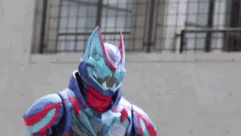 a close up of a person wearing a superhero costume .