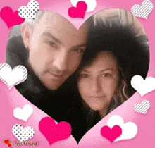 a picture of a man and a woman in a heart surrounded by pink hearts
