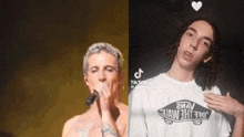 a man singing into a microphone next to another man wearing a white vans shirt