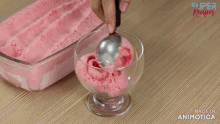 a glass filled with pink ice cream and strawberry sauce is made by super recipes