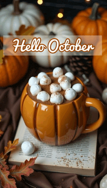 a mug of hot chocolate with marshmallows and the words hello october on the bottom