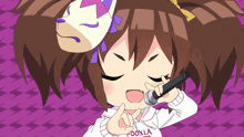 a girl with a mask on her head is singing into a microphone and wearing a hoodie that says cookla