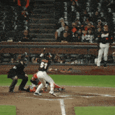 a baseball player with the number 51 on his back swings at a pitch