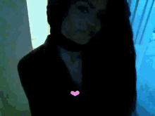 a woman wearing a choker and a pink heart necklace