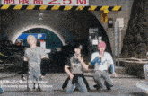 a group of people are kneeling down in front of a sign that says groove just wanna know climax
