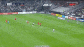 a large crowd of people watching a soccer game with the words gol on the top
