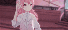 a girl with pink hair is wearing a white top and earrings