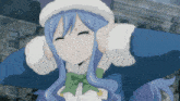 a girl with blue hair is wearing a cat hat