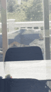 a man is laying on a couch in front of a glass door