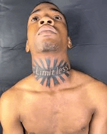 a shirtless man with a tattoo on his neck that says `` limitless '' .