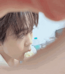 a close up of a person 's face with their mouth open