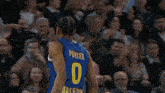 a basketball player named punter wears a number 0 jersey