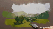 a person is painting a landscape with the words made in animotica below it