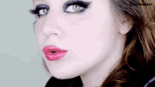 a close up of a woman 's face with a watermark on the bottom right corner that says @kailee leon
