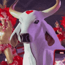 a statue of a bull with a heart on its nose