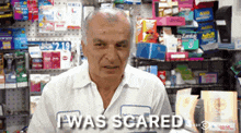 a man in a white shirt says i was scared in a store