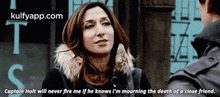 a woman in a fur coat is talking to a man in a black jacket .