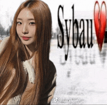 a girl with long hair is standing in front of a sybau logo