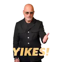 a man in a suit and sunglasses waving with the word yikes in yellow