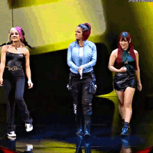 three women are standing on a stage with the hashtag #thenextbigthing