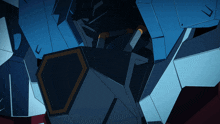 a close up of a blue and white robot with a yellow shield