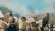 a group of girls are standing next to each other with one wearing a shirt that says ' nct dream ' on it