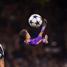 a soccer player with the name ronaldo on his jersey kicks a ball