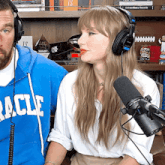 a man wearing headphones and a woman wearing a miracle sweatshirt