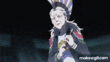an elderly woman is holding a fan in her hand and looking at the camera .