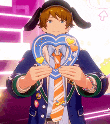 a man in a suit and tie is holding a heart shaped object in his hands