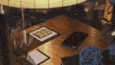 a table with a cell phone a pen and a glass