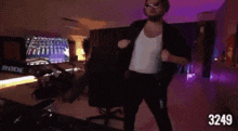 a man is dancing in a room with the number 3294 on the bottom right