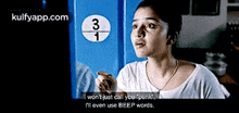 a woman is talking to someone in front of a sign that says 3 and 1