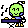 a pixel art illustration of a green skull sitting on a table .